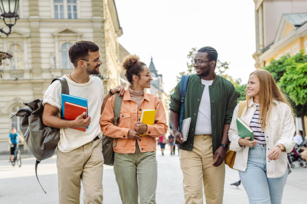Group of University students walking on the street and talking